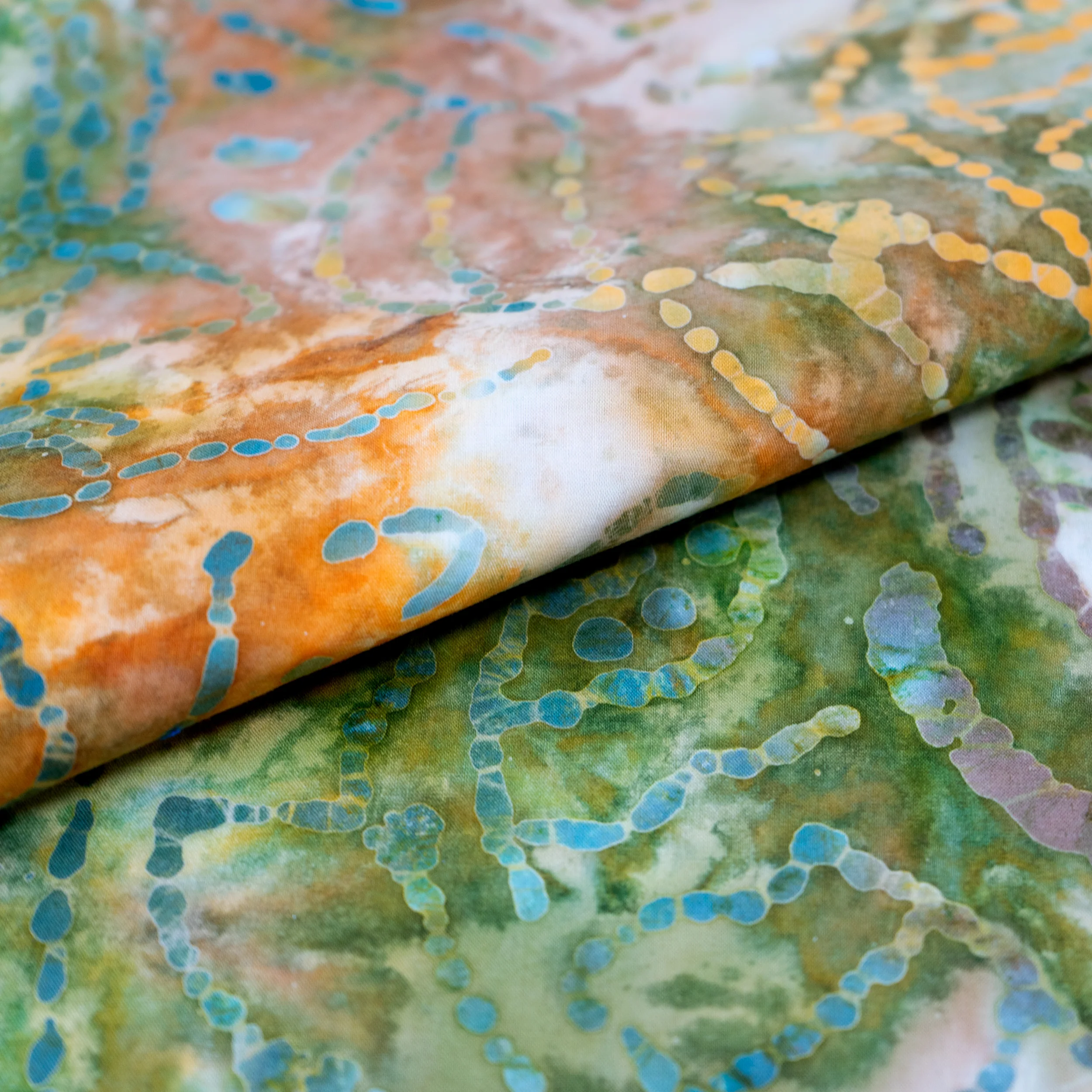 SINGER® Fabric 100% Cotton Batik Collection 42 inch Wide Green and Orange Leaves Cut by the Yard 1 SINGER® Fabric 100% Cotton Batik Collection 42 inch Wide Green and Orange Leaves Cut by the Yard